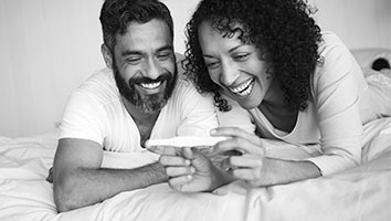 Smiling couple looking at pregnancy test
