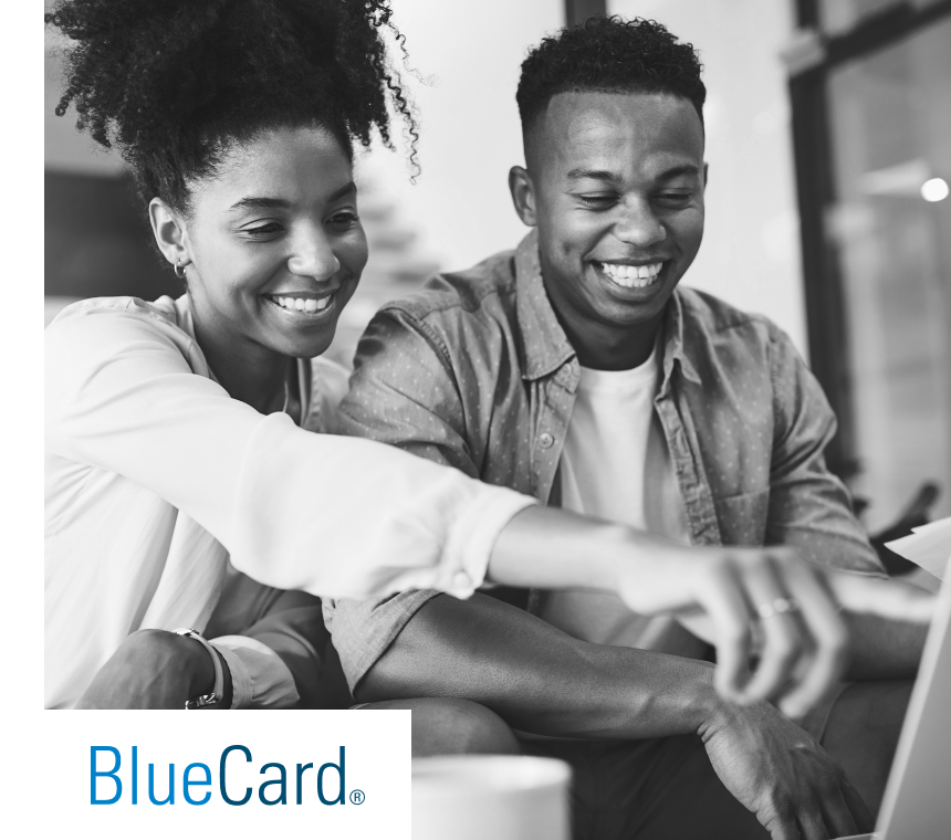 Blue Card Couple Pointing at Laptop